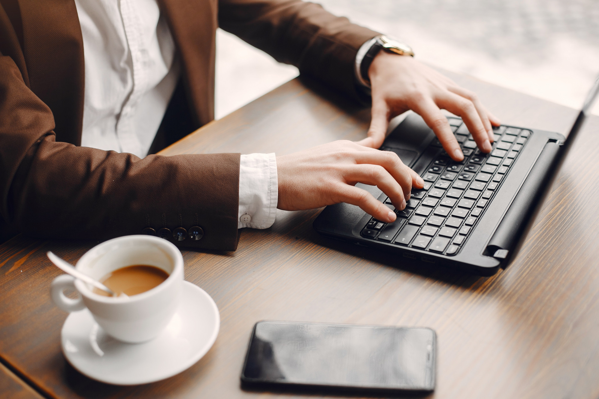 stylish-businessman-working-cafe.jpg